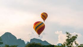 Begin your travel day with Vang Vieng’s serene ambiance